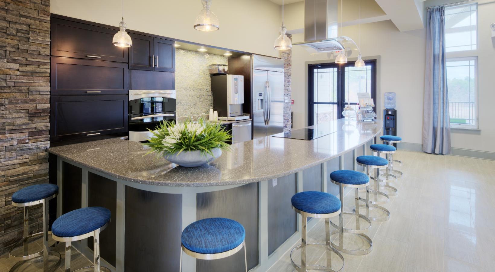 Find your perfect fit at Langtree at Lake Norman a kitchen with a bar and stools