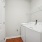 Laundry room with appliances and shelving
