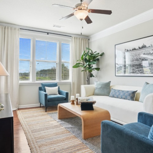 Relax and unwind in stylish living spaces Stylish living space with large windows and open layout