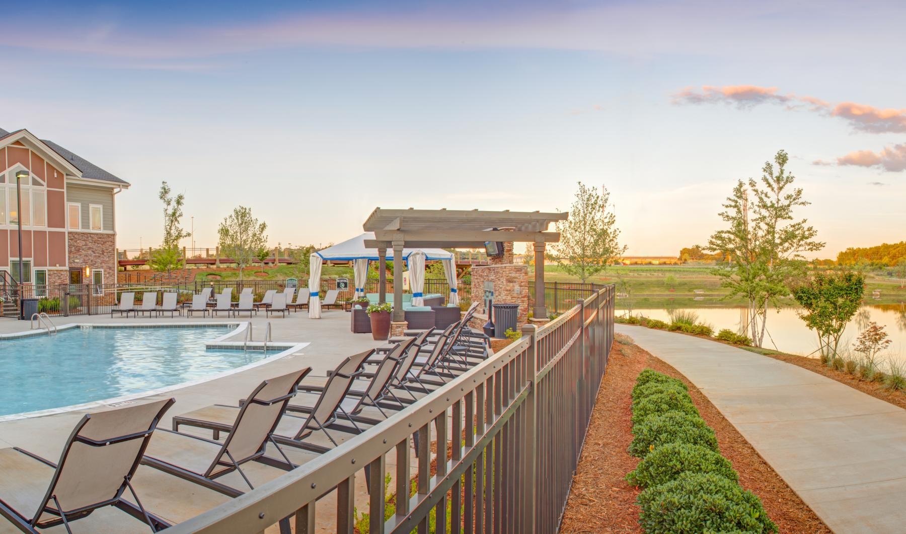 Resort-style swimming pool a swimming pool in a backyard
