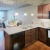 a kitchen with wooden cabinets