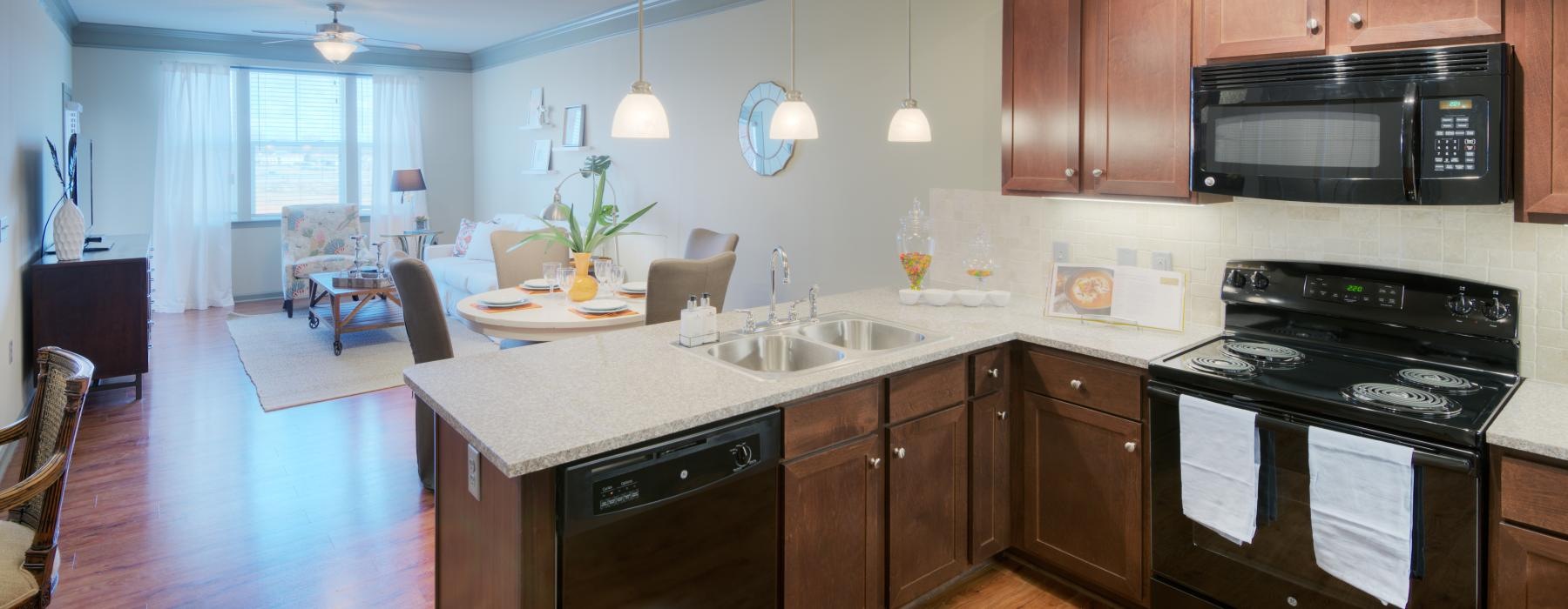 a kitchen with wooden cabinets